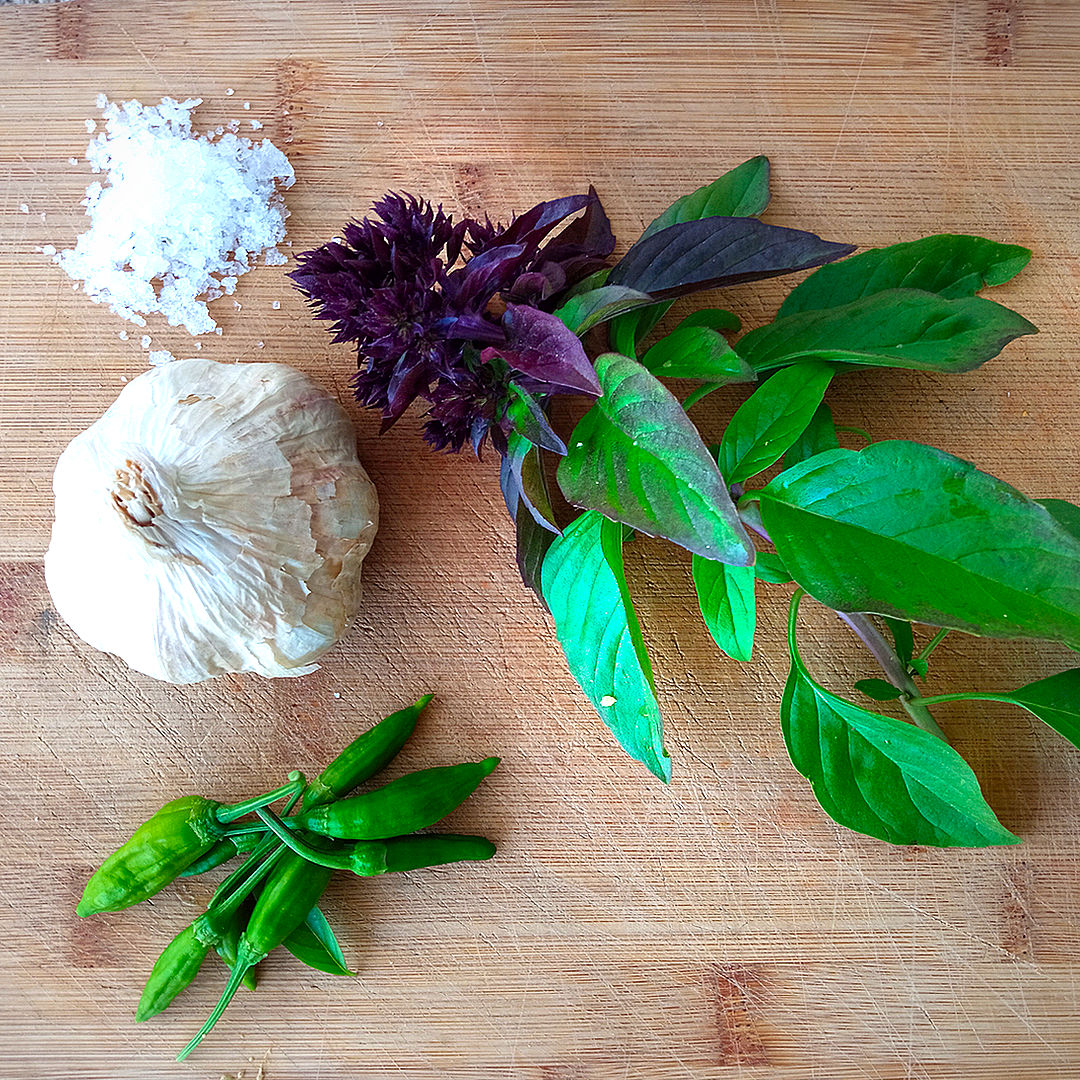 world of chillies thai basil on wooden board