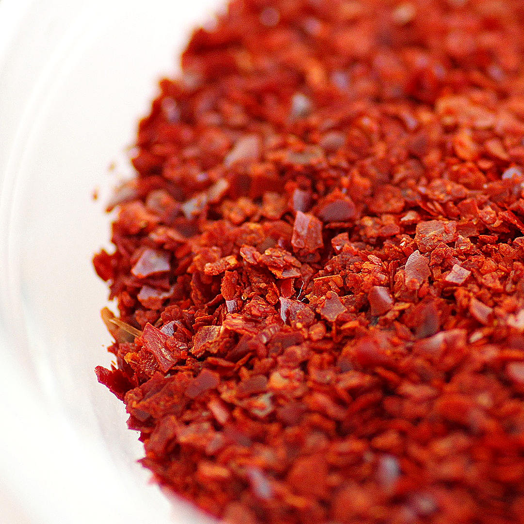 world of chillies close-up of coarse dried Korean red chilli flakes used in kimchi