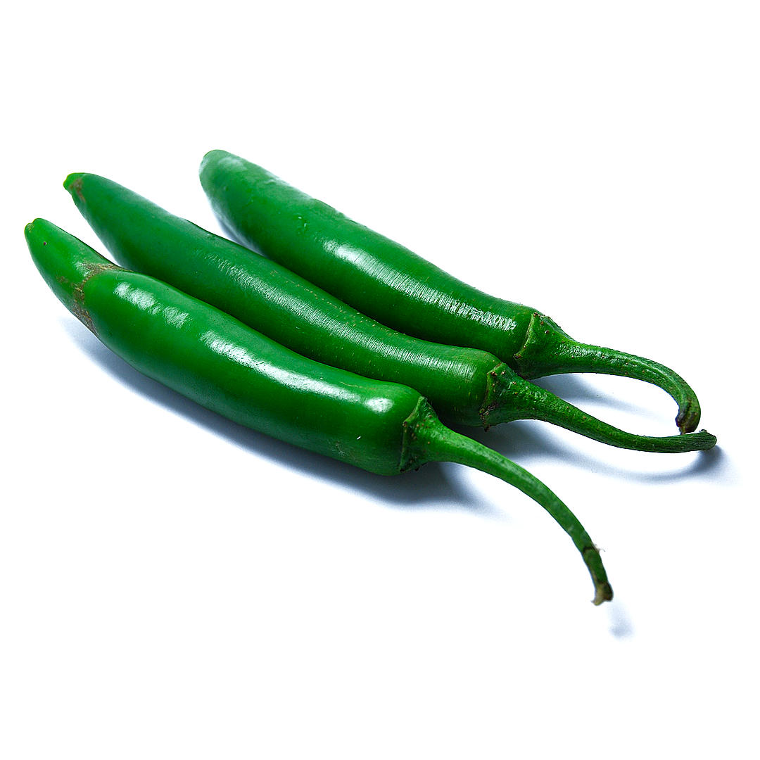 World of Chillies fresh green Serrano chillies on white background